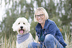 woman and Labradoodle