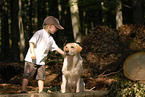 boy and labrador retriever