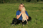 girl with Labrador Retriever Puppies