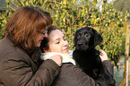 women with Labrador Retriever Puppy