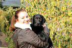 woman with Labrador Retriever Puppy