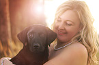 woman and Labrador Retriever