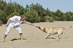 man with Labrador Retriever