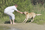 man with Labrador Retriever