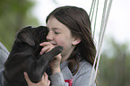 girl with Labrador Retriever Puppy