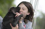 girl with Labrador Retriever Puppy