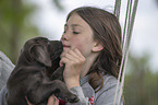 girl with Labrador Retriever Puppy