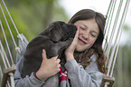 girl with Labrador Retriever Puppy