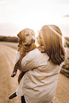 woman and Labrador Retriever Puppy