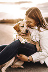 woman and Labrador Retriever Puppy