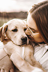 woman and Labrador Retriever Puppy