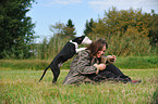 woman and Louisiana Catahoula Leopard Dog