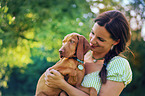 woman and Magyar Vizsla Puppy