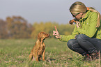 woman with Magyar Vizsla puppy