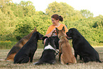 woman and 5 dogs