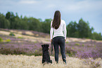 young woman with Miniature Australian Shepherd