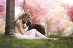 young woman with Miniature Australian Shepherd