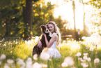 young woman with Miniature Australian Shepherd