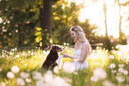 young woman with Miniature Australian Shepherd