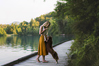 young woman with Miniature Australian Shepherd