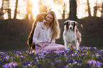 young woman with 2 Miniature Australian Shepherds