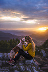 young woman with Miniature Australian Shepherd