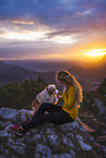 young woman with Miniature Australian Shepherd