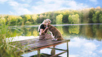 young woman with Miniature Australian Shepherd