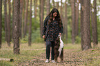 woman and Miniature Australian Shepherd