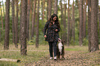 woman and Miniature Australian Shepherd