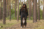 woman and Miniature Australian Shepherd