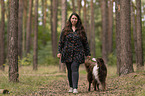 woman and Miniature Australian Shepherd