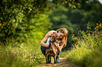 woman and Miniature Bullterrier