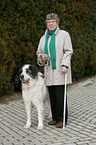 older woman with old dog