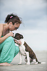 woman and young Olde English Bulldog