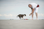 man and young Olde English Bulldog