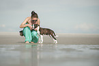 woman and young Olde English Bulldog