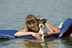 woman and dog in the water