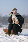 woman and Parson Russell Terrier in the snow