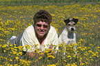 woman with Parson Russell Terrier in flower field