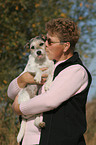 woman kisses Parson Russell Terrier