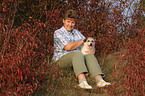 woman fondles Parson Russell Terrier