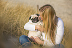 young woman with pug