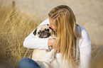 young woman with pug