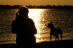 woman and Andalusian Mouse-Hunting Dog