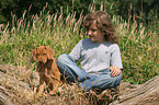boy with Rhodesian Ridgeback puppy
