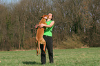 woman with Rhodesian Ridgeback