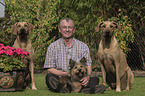 man with 3 Dogs