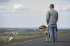 man with Rhodesian Ridgeback