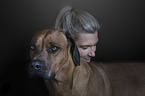 woman with Rhodesian Ridgeback